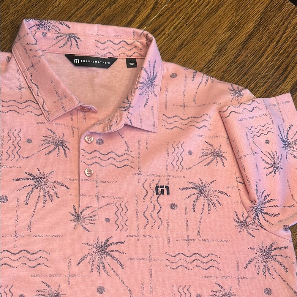 Travis Mathew Pink Polo Shirt with Tropical Pattern